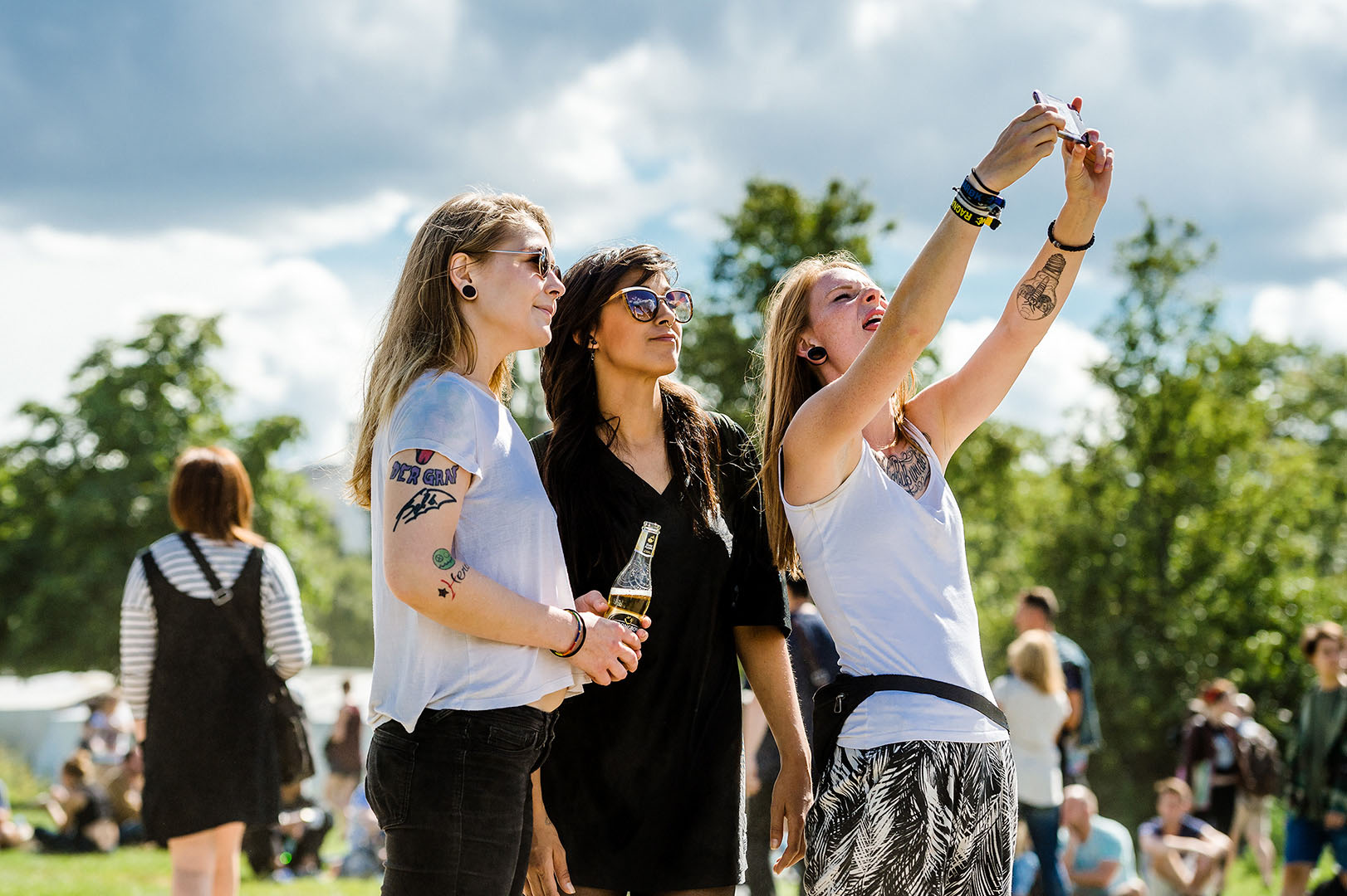 Three women taking selfie in Mauerpark Berlin