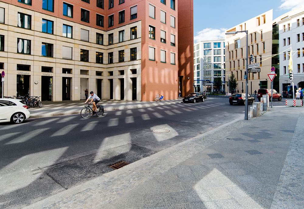 Berlin street scene revisiting the location of "The Promise" section of the Berlin Wall from 1987 photograph