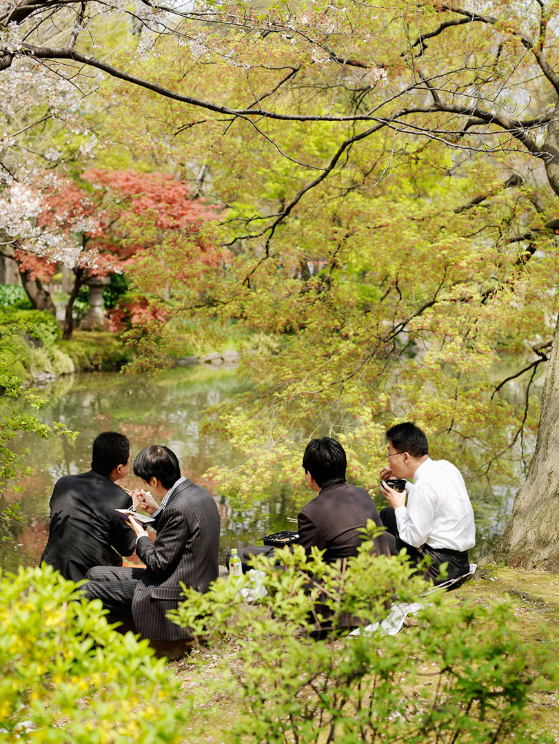 4 men having lunch in Hibya Park Tokyo