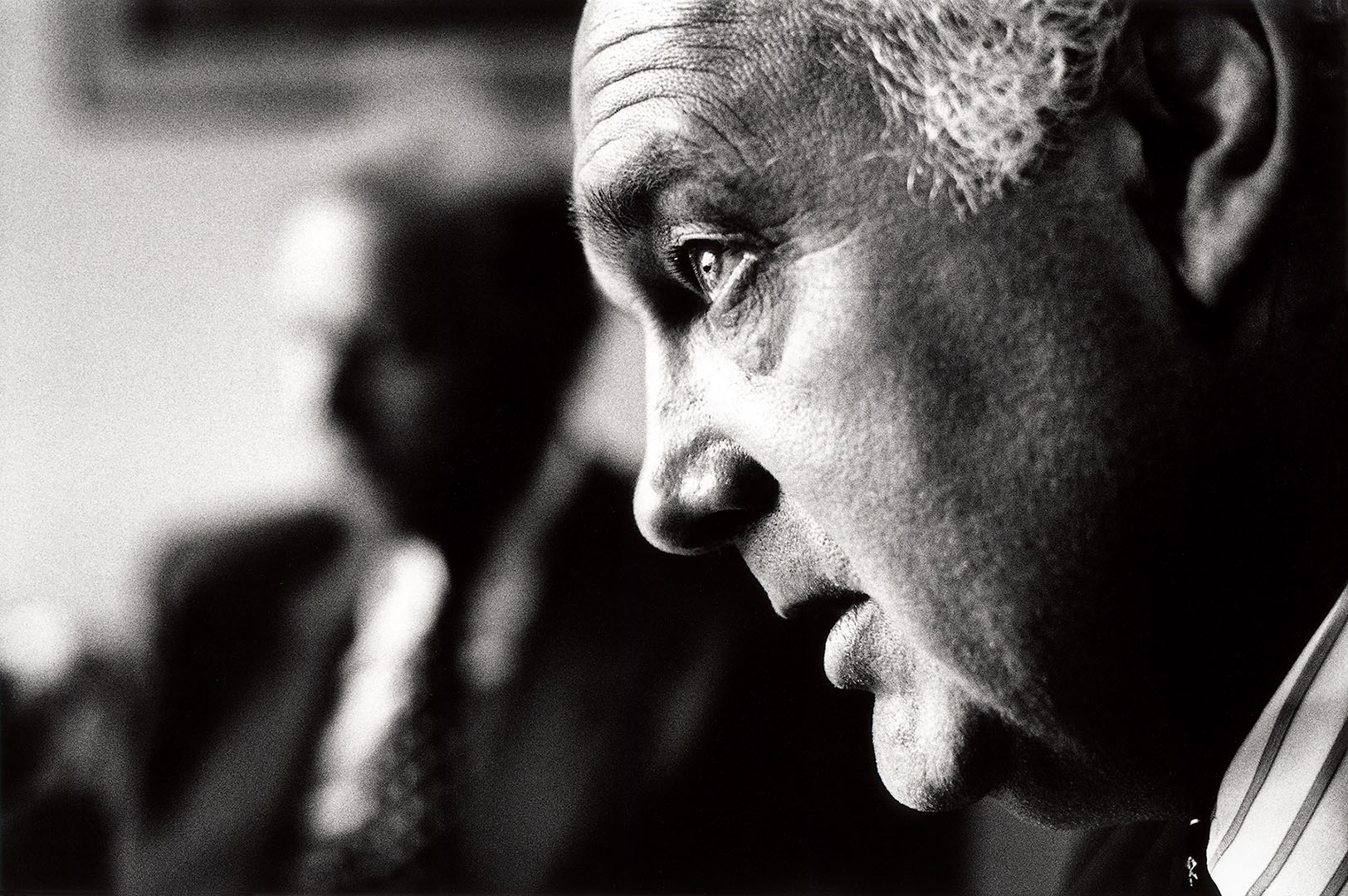 Closely cropped B&W portrait of Chairman in profile