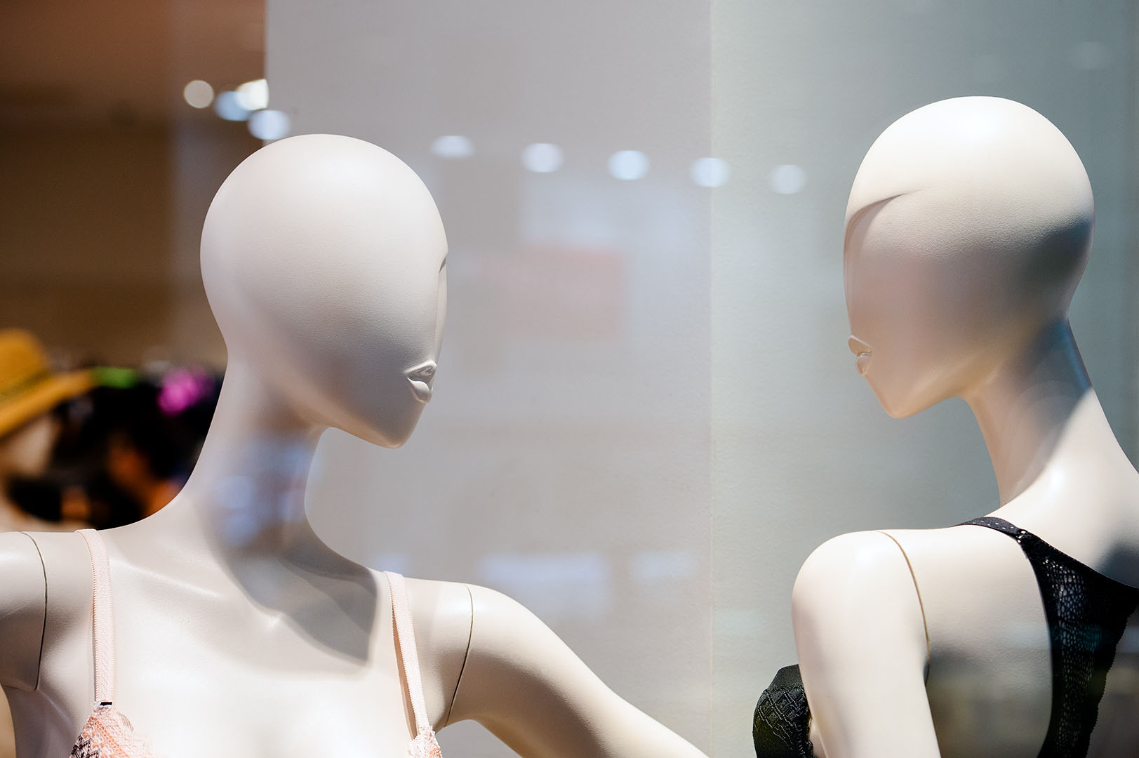 Two diva mannequins in staring contest