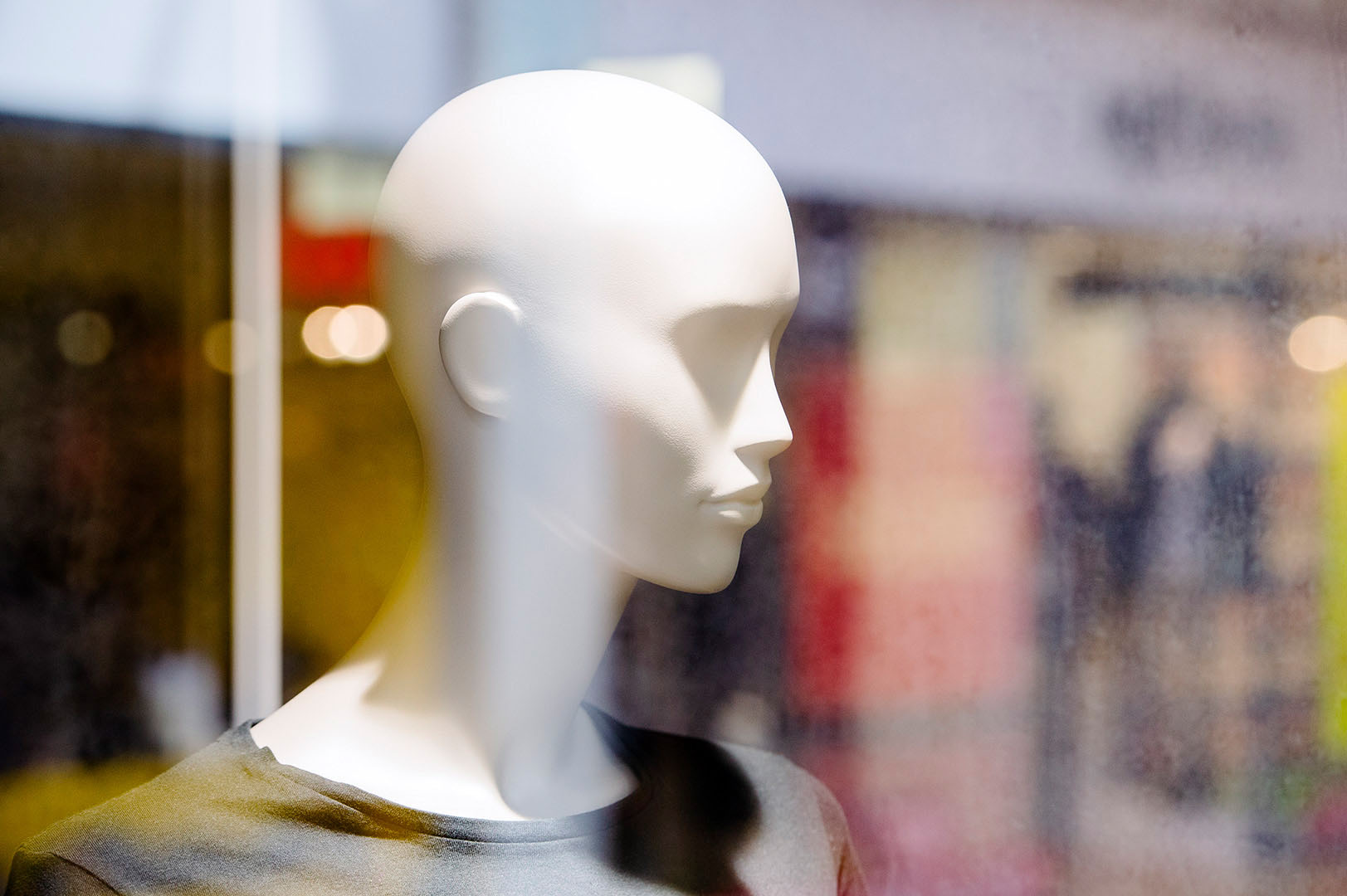 Shop mannequin looking to the right of frame