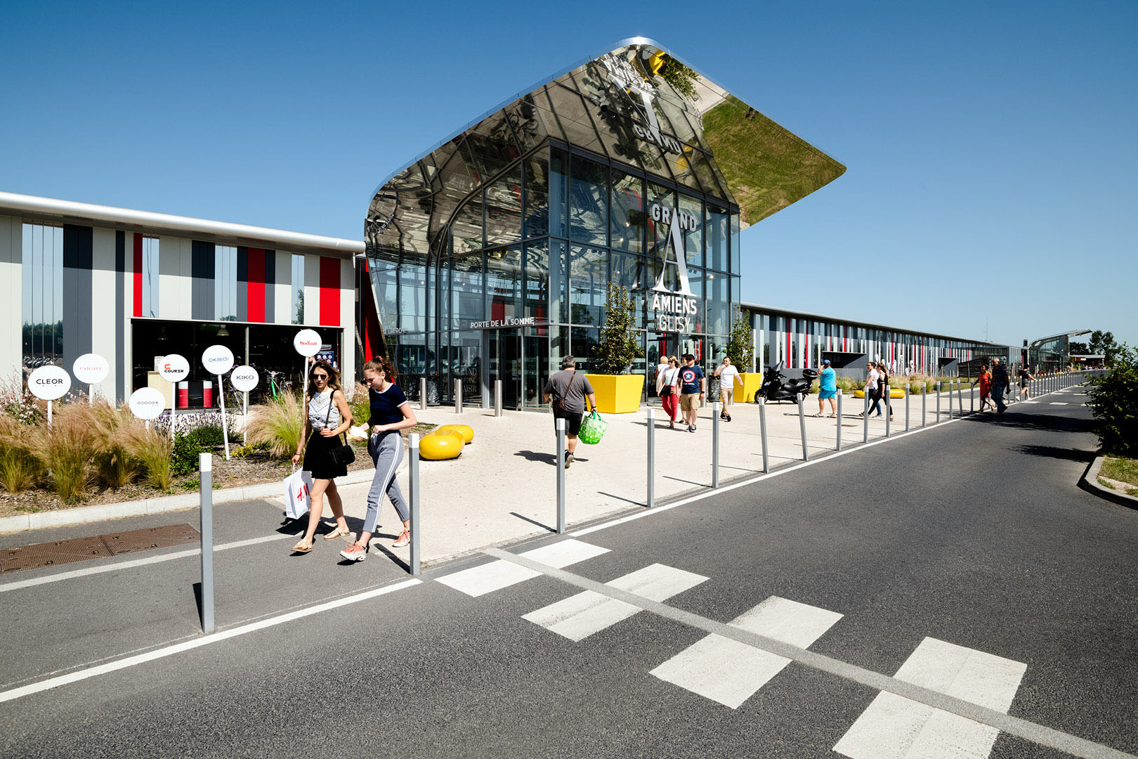 Exterior of entrance to European shopping centre with Crossing in foreground