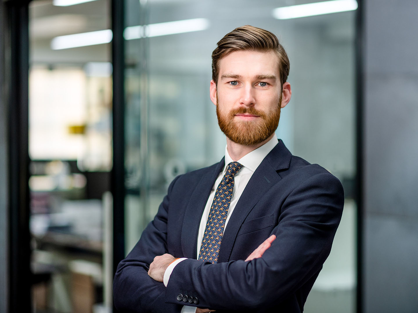 Corporate portrait of man in suit looking to camera