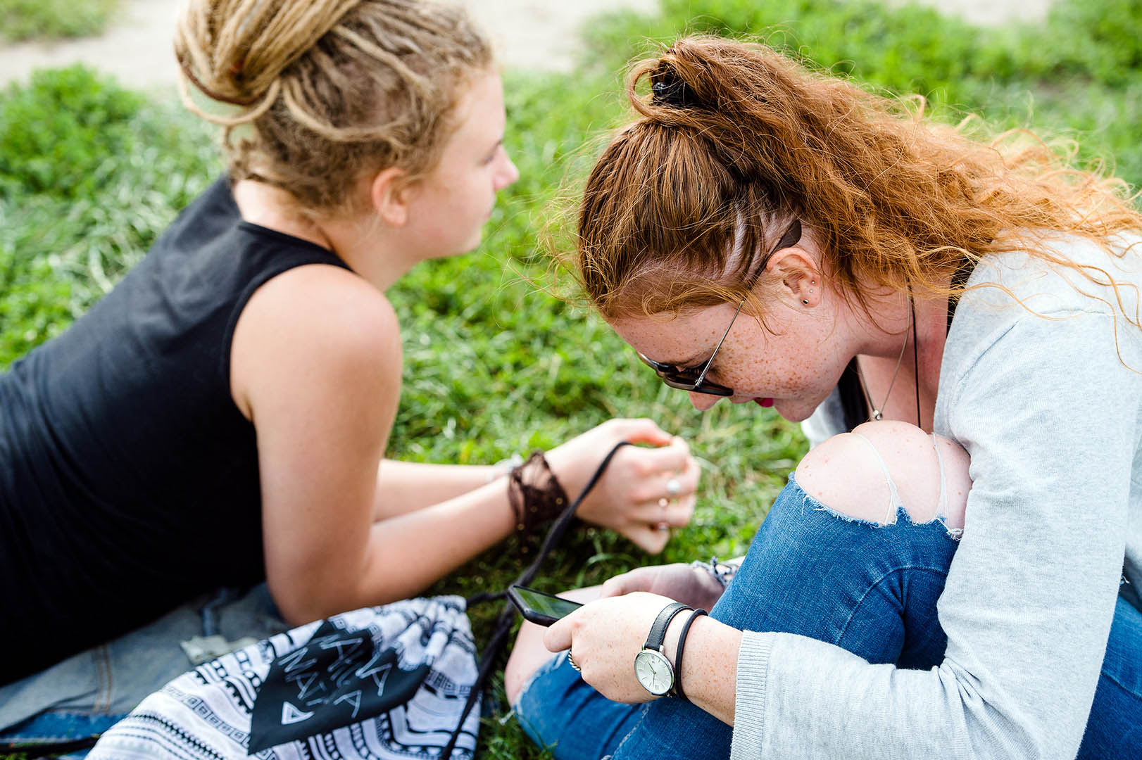 Two girls chilling out in Mauerpark Berlin