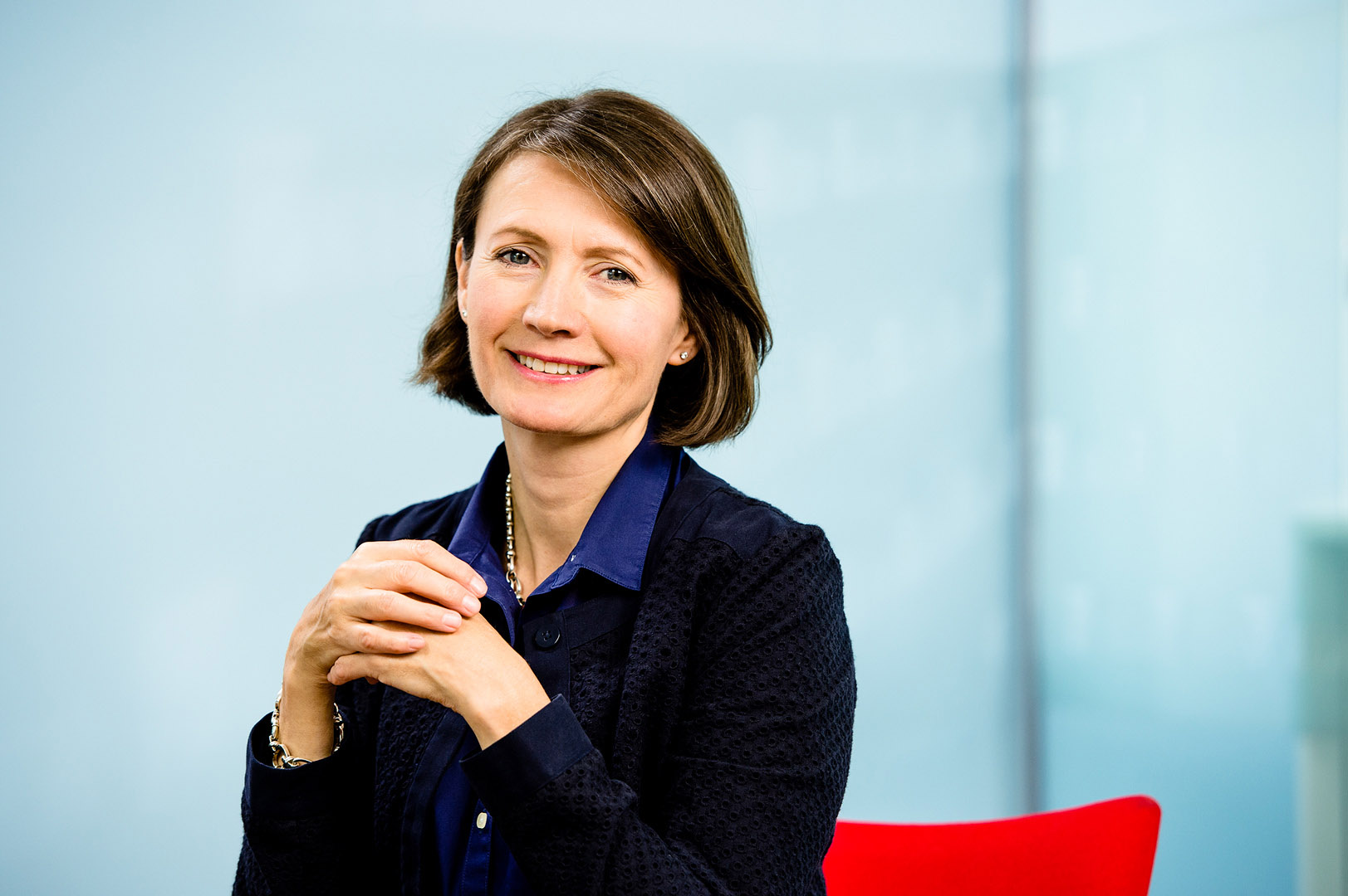 Reportage style portrait of female director looking to camera