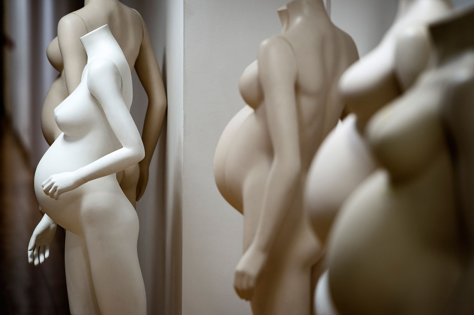 Undressed maternity mannequins waiting to be chosen