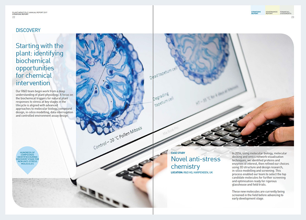 Close up of laptop in use on printed spread of Plant Impact Report & Accounts 