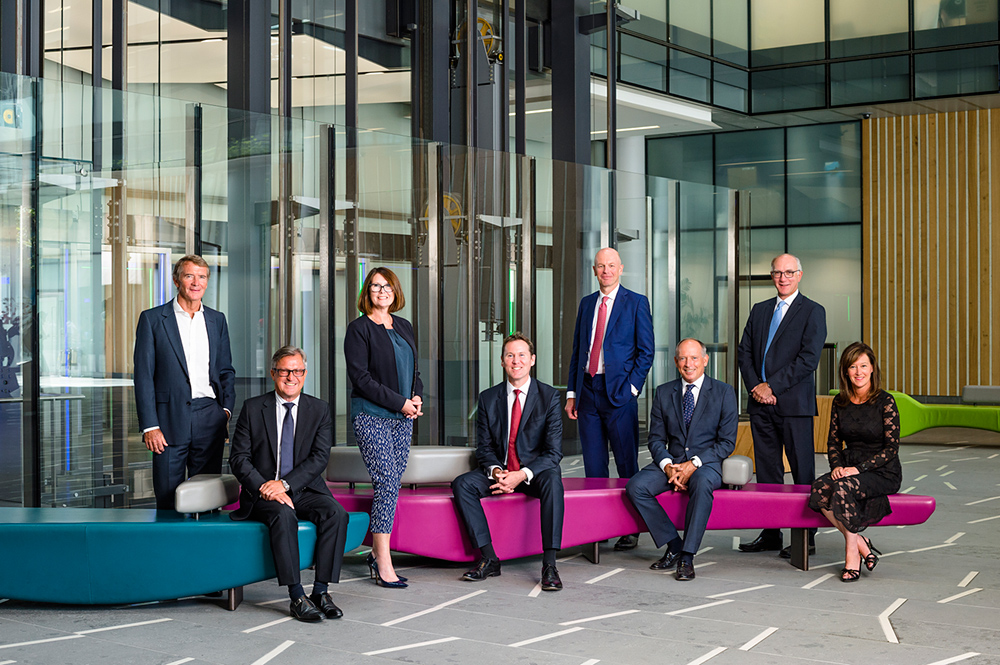 Board of directors in corporate reception area