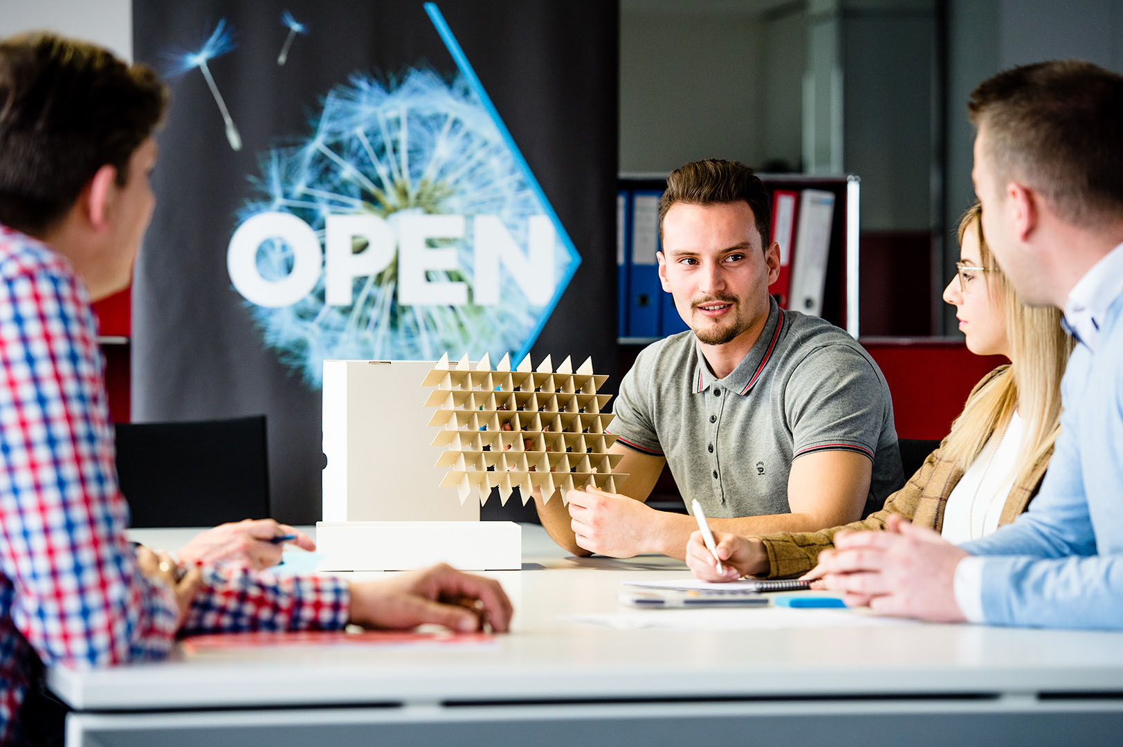 Production team meeting discussing a product