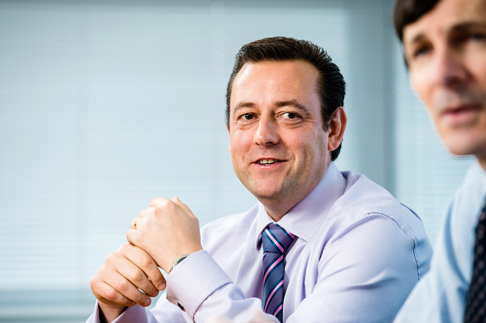 Reportage style shot of director in a meeting