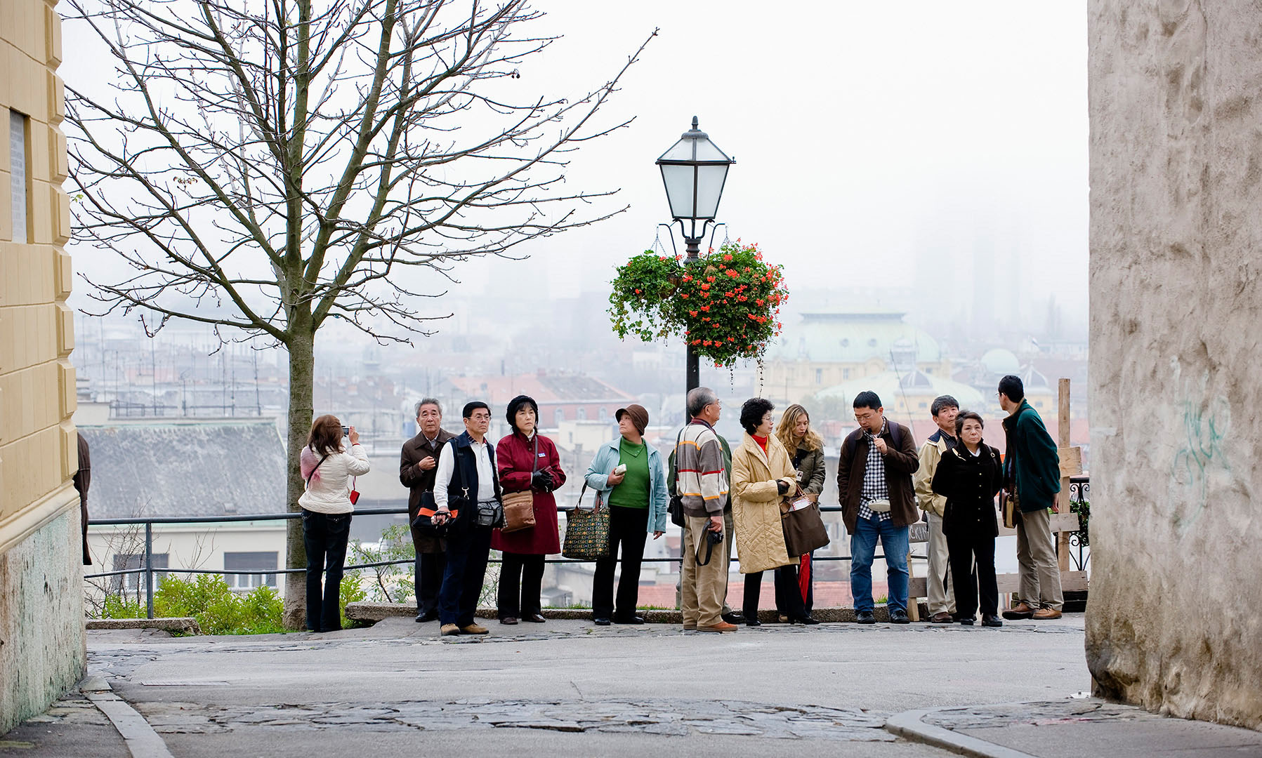Japanese tourist group with guide in Prague