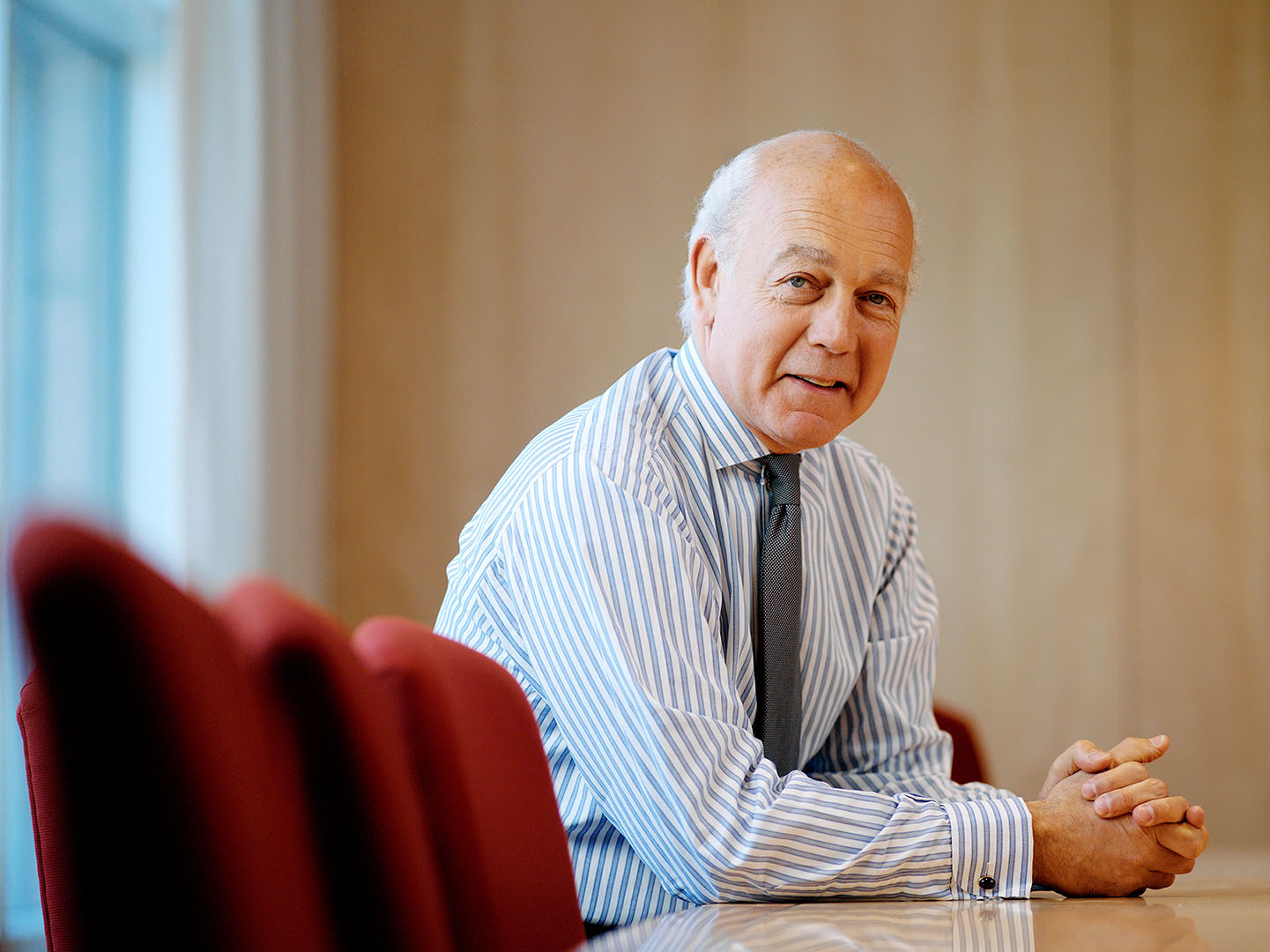 Director sat at table looking to camera