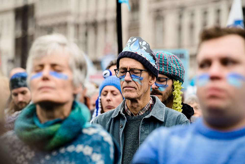Protesters in silent contemplation at March for clean water in Westminster