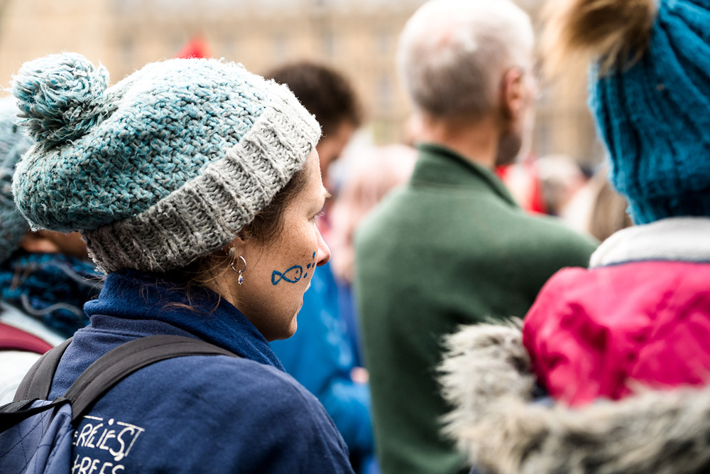 Female protester in crowd at River Action demo in Westminster