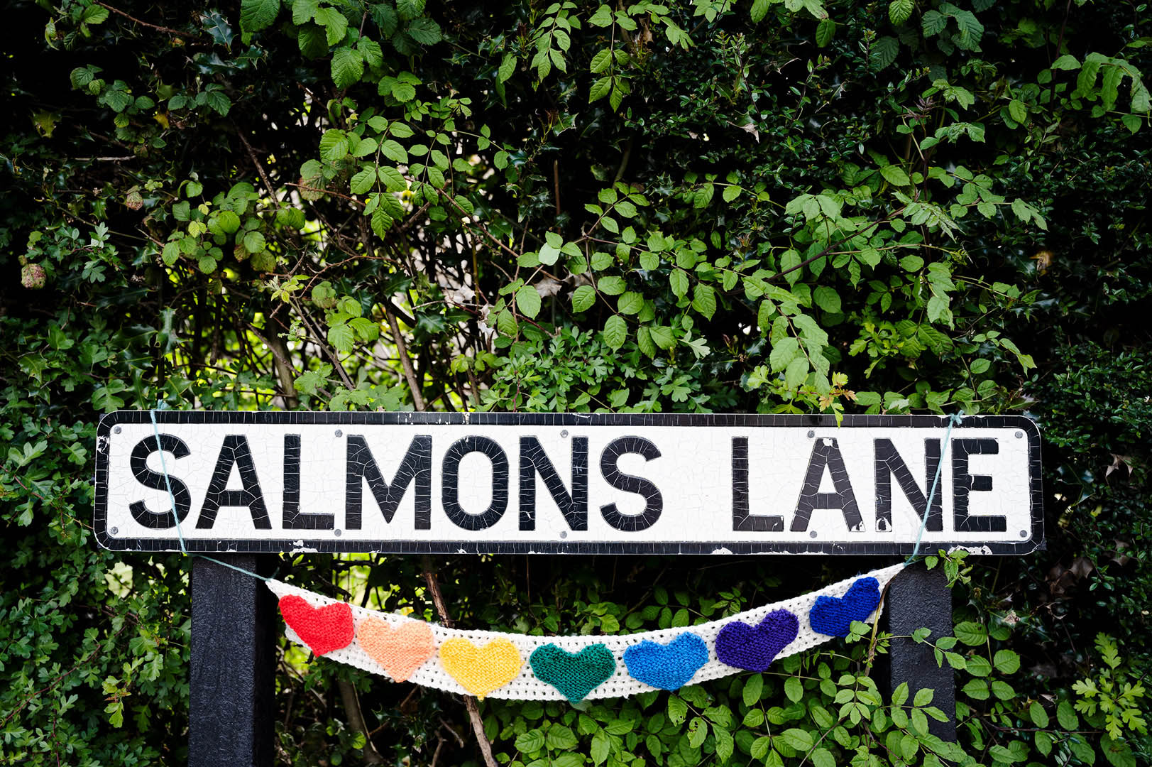 Rainbow Hearts draped from street sign during lockdown