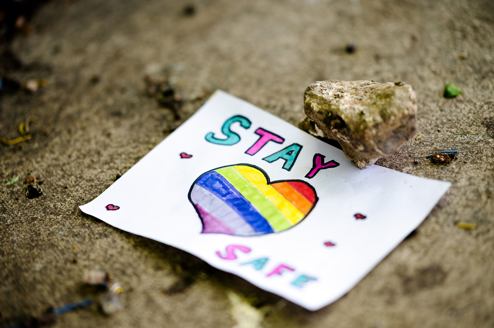 Stay safe rainbow heart drawing on pavement during lockdown