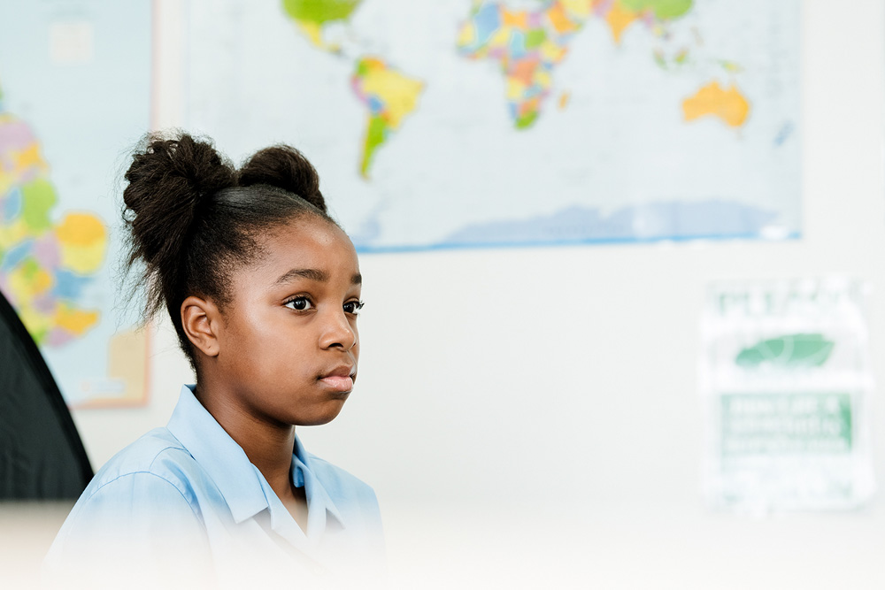 Young Black Female student in geography classroom